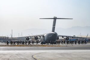 In this image provided by the U.S. Air Force, soldiers, assigned to the 82nd Airborne Division, arrive to provide security in support of Operation Allies Refuge at Hamid Karzai International Airport in Kabul, Afghanistan, Friday, Aug. 20, 2021. (Senior Airman Taylor Crul/U.S. Air Force via AP)